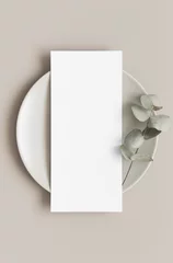 Fotobehang Menu card mockup with a eucalyptus branch on a plate, 4x9 ratio. © Snoflinga