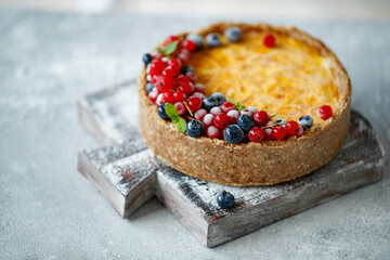 Cheesecake cake with berries. Cake with delicate curd and dough base. High quality photo.