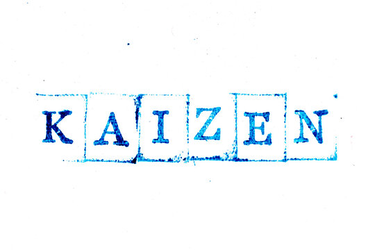 Blue color ink of rubber stamp in word kaizen on white paper background