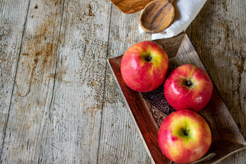 Apple background with copy space on wooden table