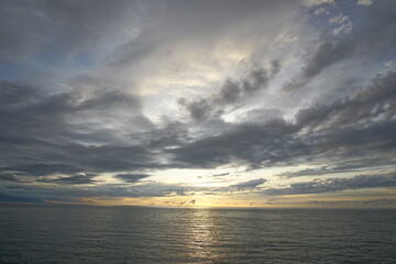 Sunset. Beautiful sunset at Japanese sea. Gold cloudy sky sunset. Picture Sea sunset.