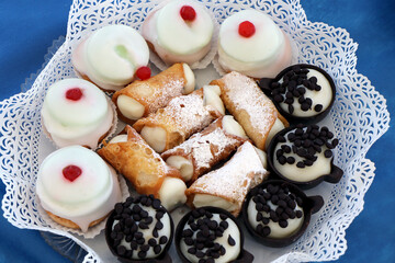 Assortment of Italian pastries ready to be enjoyed. Sicilian cassata, Sicilian cannoli
