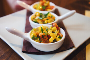 Delicious European appetizer - vegetable salsa with carrot, corn, tomato, celery and pepper