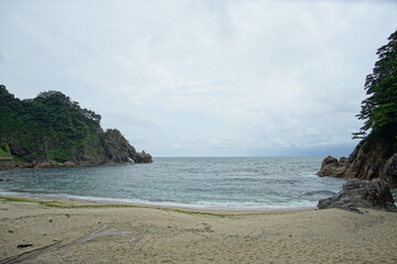 Ocean coast with rock and sand beach