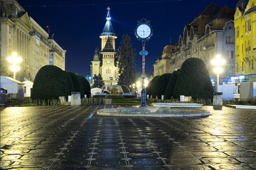 Fototapeta na wymiar The rainy evening on the Victoriei Square of Timisoara, Romania