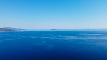 Naklejka na ściany i meble Open blue sea under blue sky.Aerial view 