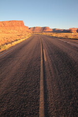 Fototapeta na wymiar Scenic view of long road leading to Island in the Sky from The needles at sunset in Canyonlands National Park Utah, USA