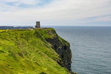 Fototapeta na wymiar Photo capture of a breathtaking natural nature landscape. Cliffs of moher with O'brien's tower, wild atlantic way. Ireland. Europe