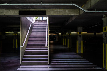 Modern concrete stairs with metal handrails