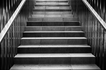 Fototapeta na wymiar Modern concrete stairs with metal handrails