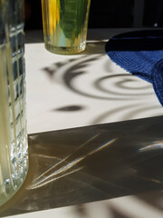 Delicious handmade lemonade on the table in small cafee with  bright lighting and interesting reflections
