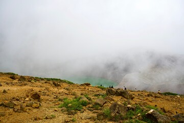 The crater lake called "Okama" with dense fog.
