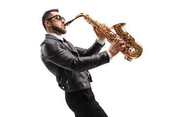 Naklejka na ściany i meble Side shot of male musician in a leather jacket playing a saxophone