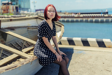 Young woman sitting down on the boat.