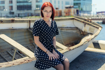 Young woman sitting down on the boat.