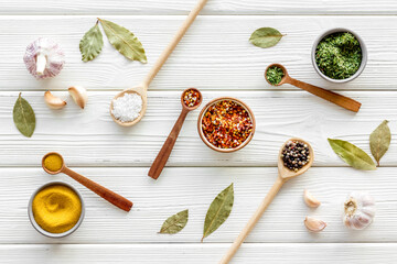 Layout of various spices in spoons. Top view, copy space
