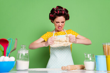 Portrait of her she nice attractive glamorous crazy evil mad wife wearing curlers kneading dough...