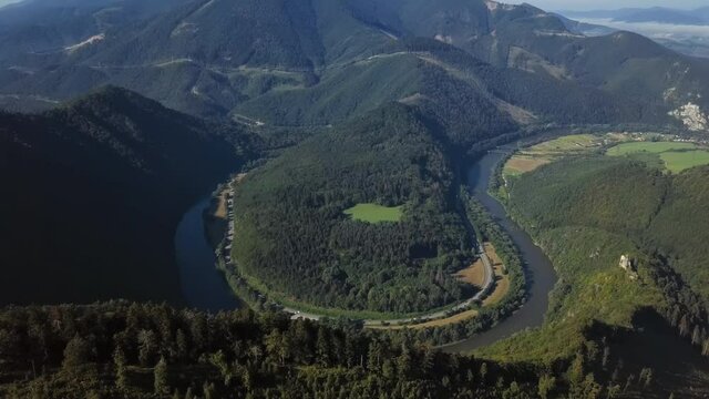 Aerial view of Domasinsky meander river bend on the Vah river, near Zilina, Slovakia. 2.5x speeded up from 24 fps.