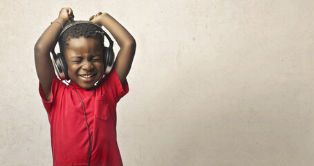 child dances listening to music