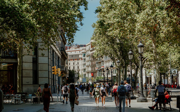Barcelona/Spain - August  2020:  people walking with Masks on during corona Pandemic on La Rambla