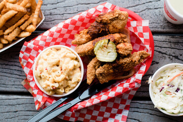 Fried chicken with mac and cheese, coleslaw, and fries from above