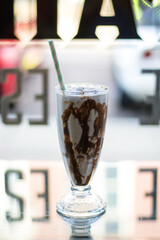 Milkshake with chocolate sauce in a restaurant