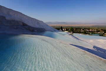 View of the beautiful Pamukkale Travertine pools, known as Cotton castle, at Hierapolis Pamukkale world heritage site in the city of Denizli, Turkey.