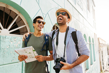 Two happy male tourists talking and having fun on the trip. Travel and love concept in Latin America
