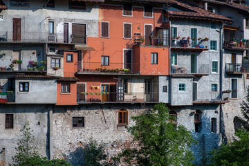 Detail of the old houses facades in Bagolino, a small town in the Lombardy Region (province of Brescia), famous for its Bagoss cheese made with goat's milk. Color image.