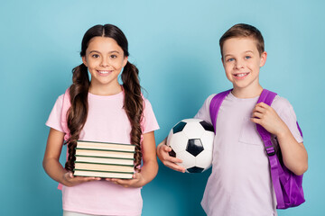 Smart a-level students ready back 1-september school concept. Two little kids girl boy hold soccer...