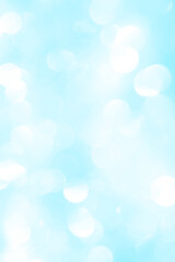 Bokeh light on blue background, sky with circle glitter light blue. Snow abstract soft glowing with vivid bright light and bokeh blur effect. 