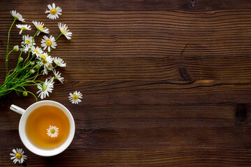Fototapeta na wymiar chamomile herbal tea in cup top view