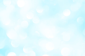 Bokeh light on blue background, sky with circle glitter light blue. Snow abstract soft glowing with vivid bright light and bokeh blur effect. 