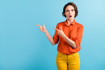 Photo of pretty shocked displeased lady direct fingers side empty space open mouth big prices...