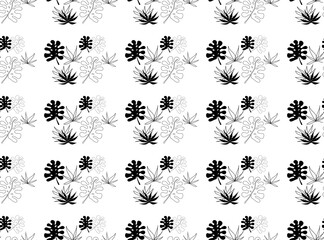 black and white seamless pattern of tropical leaves.