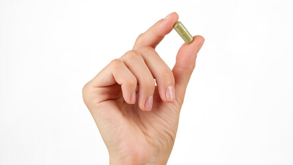 female hand holds in fingers capsule superfoods moringa or spirulina 