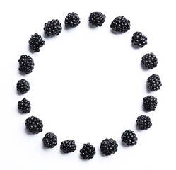 Frame of ripe blackberries on white background, flat lay. Space for text