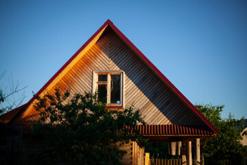 Wooden house outside the city. Summer holiday house