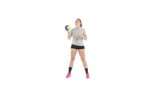 Caucasian sportswoman tossing ball. Handball training. Isolated on white background