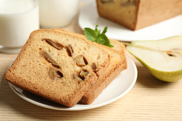 Tasty pear bread on wooden table, closeup. Homemade cake