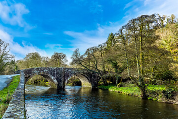 Fototapeta na wymiar A view down the Cleddau river at Llawhaden, Wales towards eighteenth-century graded 2 listed bridge