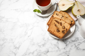Flat lay composition with pear bread on white marble table, space for text. Homemade cake