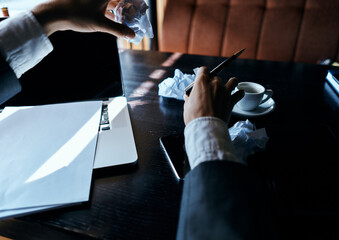 Cafe papers on the table crumpled paper coffee cup executive businesswoman lifestyle
