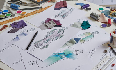 Fashion designer stylish drawings sketches textile fabric material Costume. Designer creative...