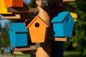 Bird houses. Colored birdhouses on the street.