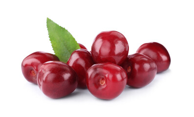 Tasty ripe red cherries with green leaf isolated on white