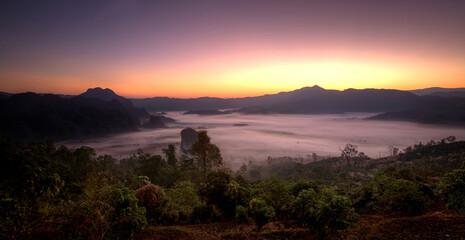 sunrise over the mountains with morning fog