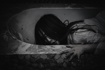 Portrait of asian woman make up ghost face with blood,Horror scene,Scary background,Halloween...