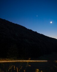 returning home in the mountains with the moon by night