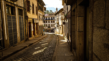 Fototapeta premium Side photo of the streets of amarante city, and some houses, Portugal.